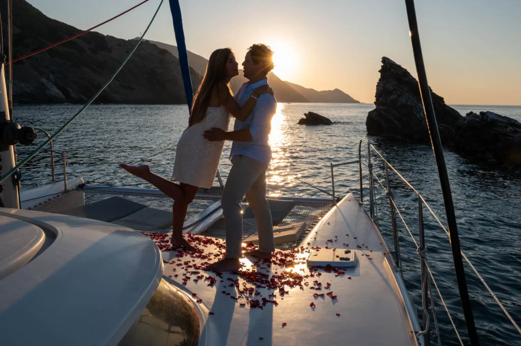 Stories from Crete 5 Christophe and Lisa kissing on a catamaran at sunset in Bali, Crete during their marriage proposal