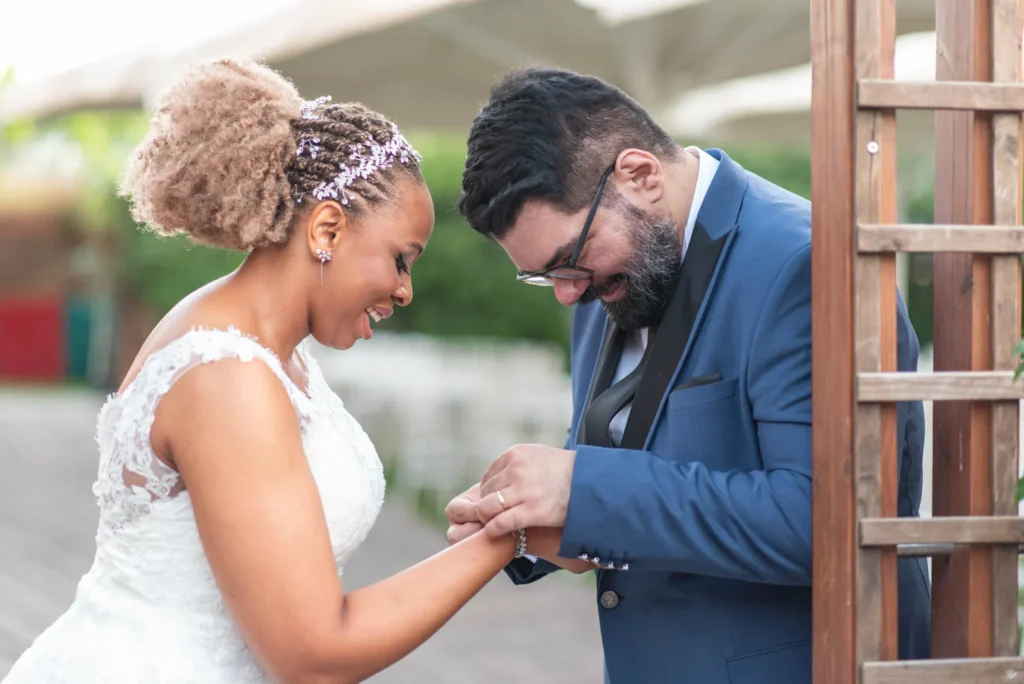 Stories from Crete 6 Groom putting wedding ring on bride during intimate wedding in Archanes Crete