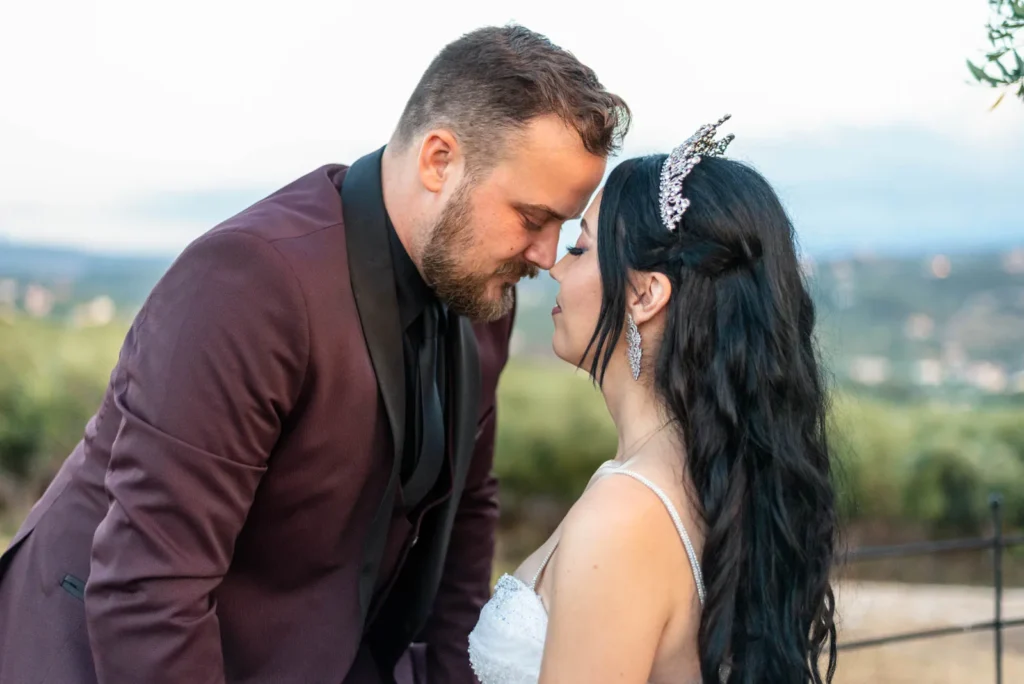 Maria and Konstantinos during their next day wedding photoshoot at Koumos in Chania, Crete.