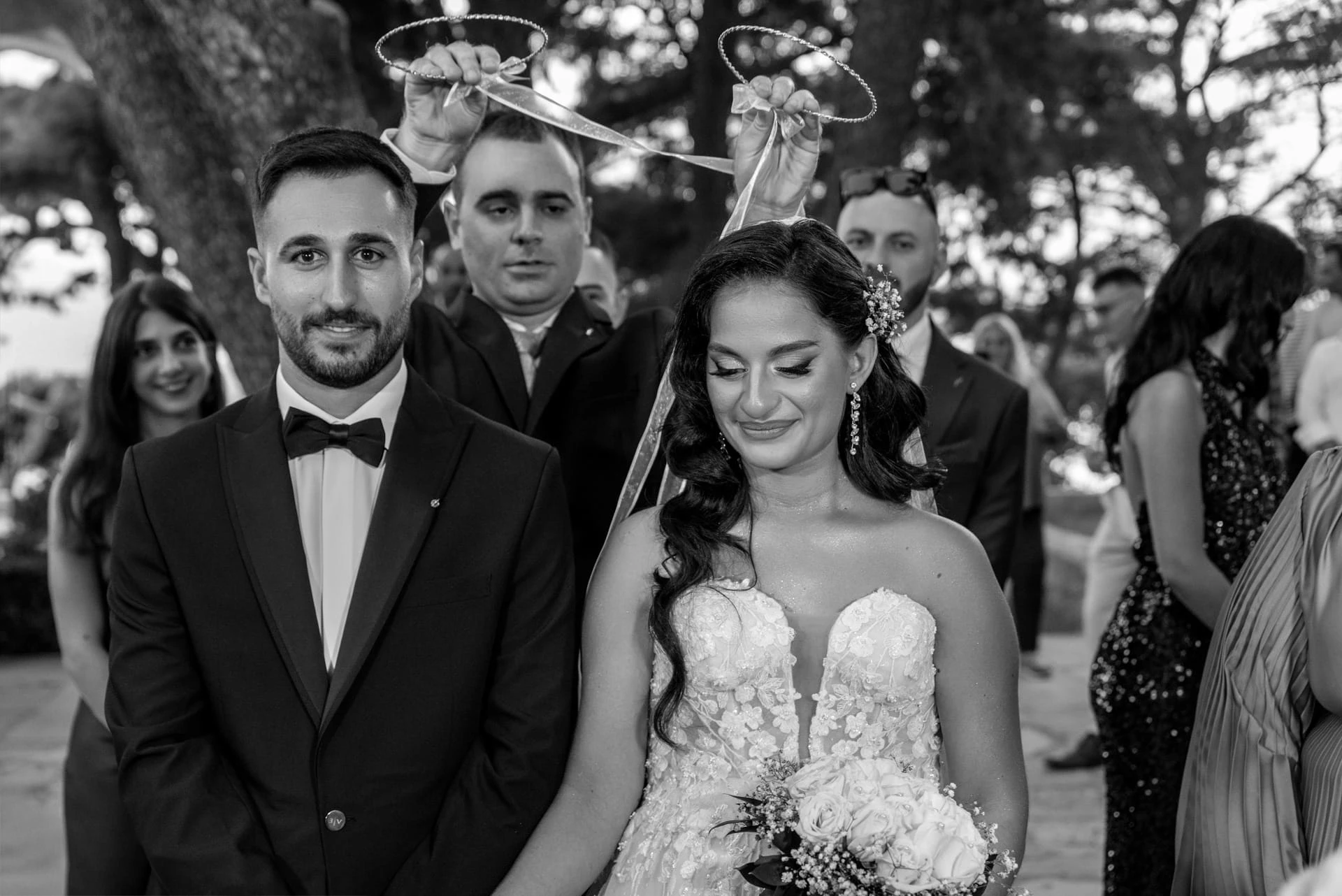 Bride and groom outside Profitis Ilias Church overlooking Chania after their Orthodox wedding ceremony.